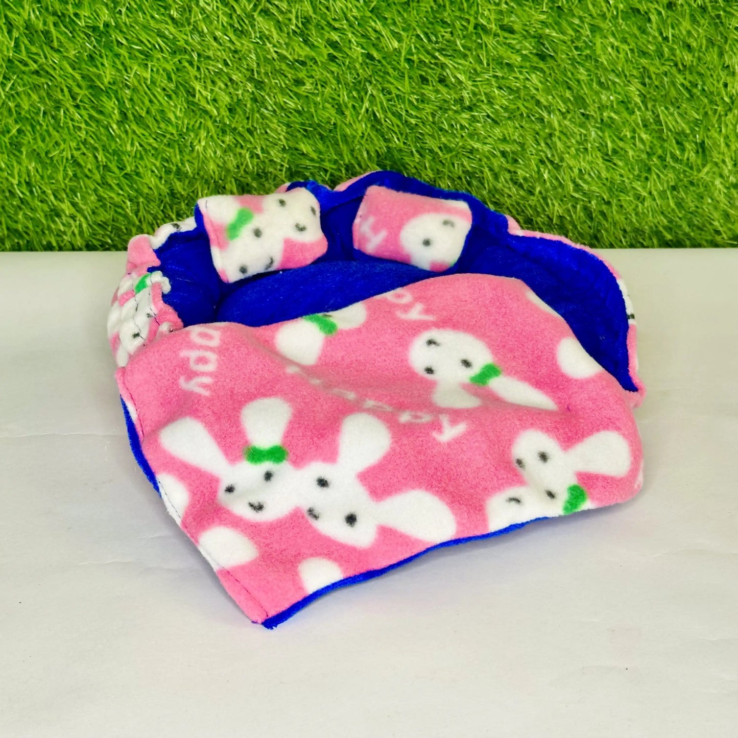 Front view of a cute Bunny Print Laddu Gopal Bedding Set with Pink Fleece Blanket & Pillow.