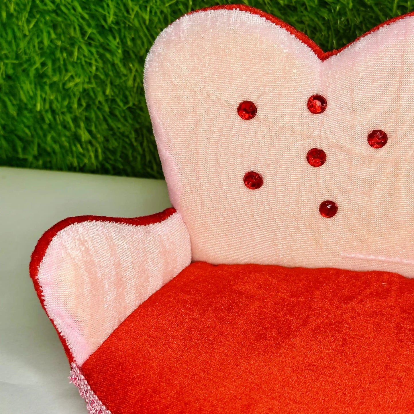 Close view of a Designer Pink & Red Velvet Laddu Gopal Sofa, a Comfortable Decorative Singhasan.