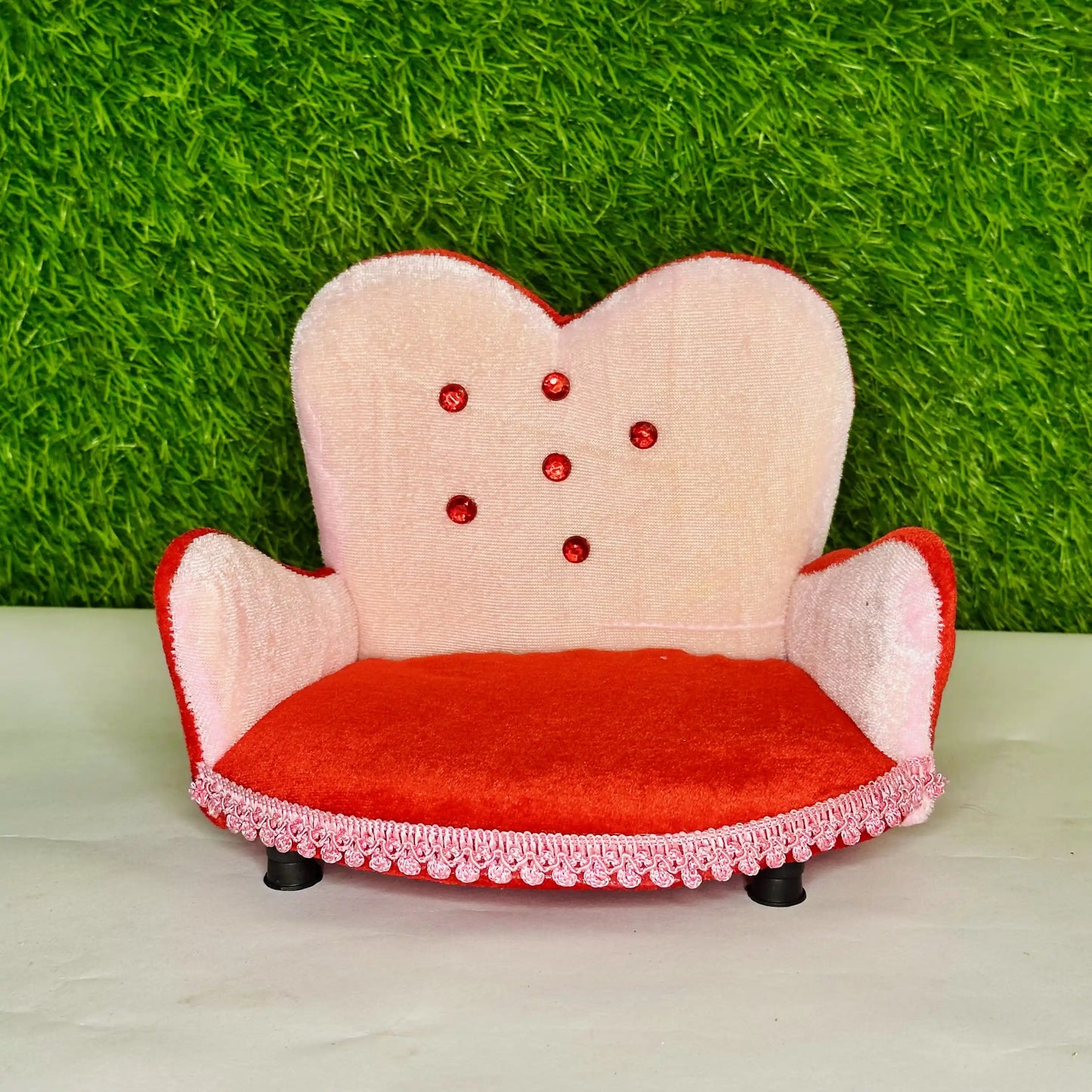 Front view of a Designer Pink & Red Velvet Laddu Gopal Sofa, a Comfortable Decorative Singhasan.