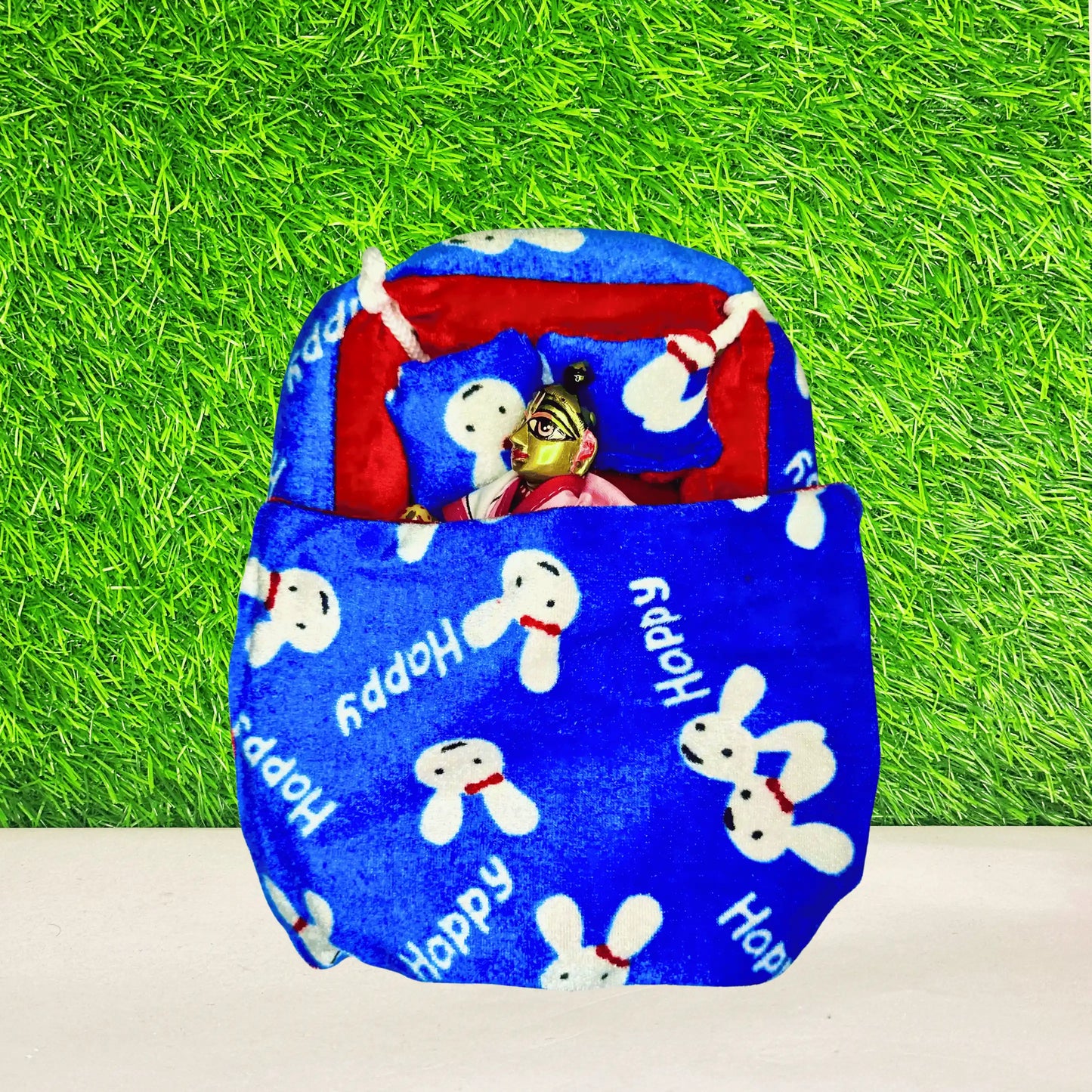 Laddu gopal ji sleeping in a Blue & Red Bunny Print Winter Laddu Gopal Bedding Set with Pillow & Blanket.