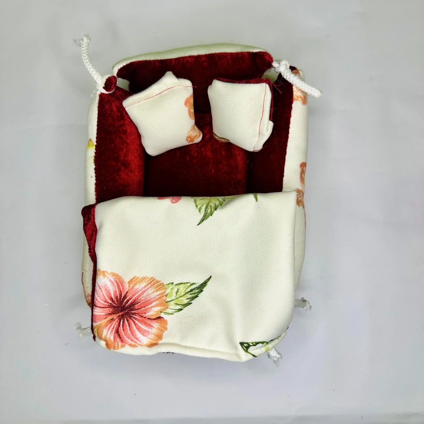 Top View of an Elegant Floral Print Laddu Gopal Bedding Set with Red Velvet Base with Blanket.
