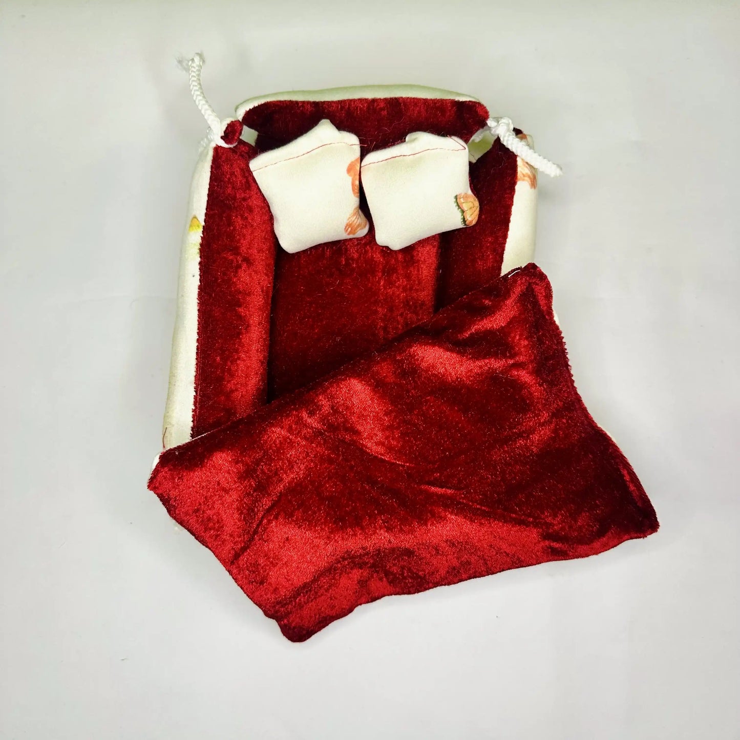 Top View of an Elegant Floral Print Laddu Gopal Bedding Set with Red Velvet Base & Blanket.