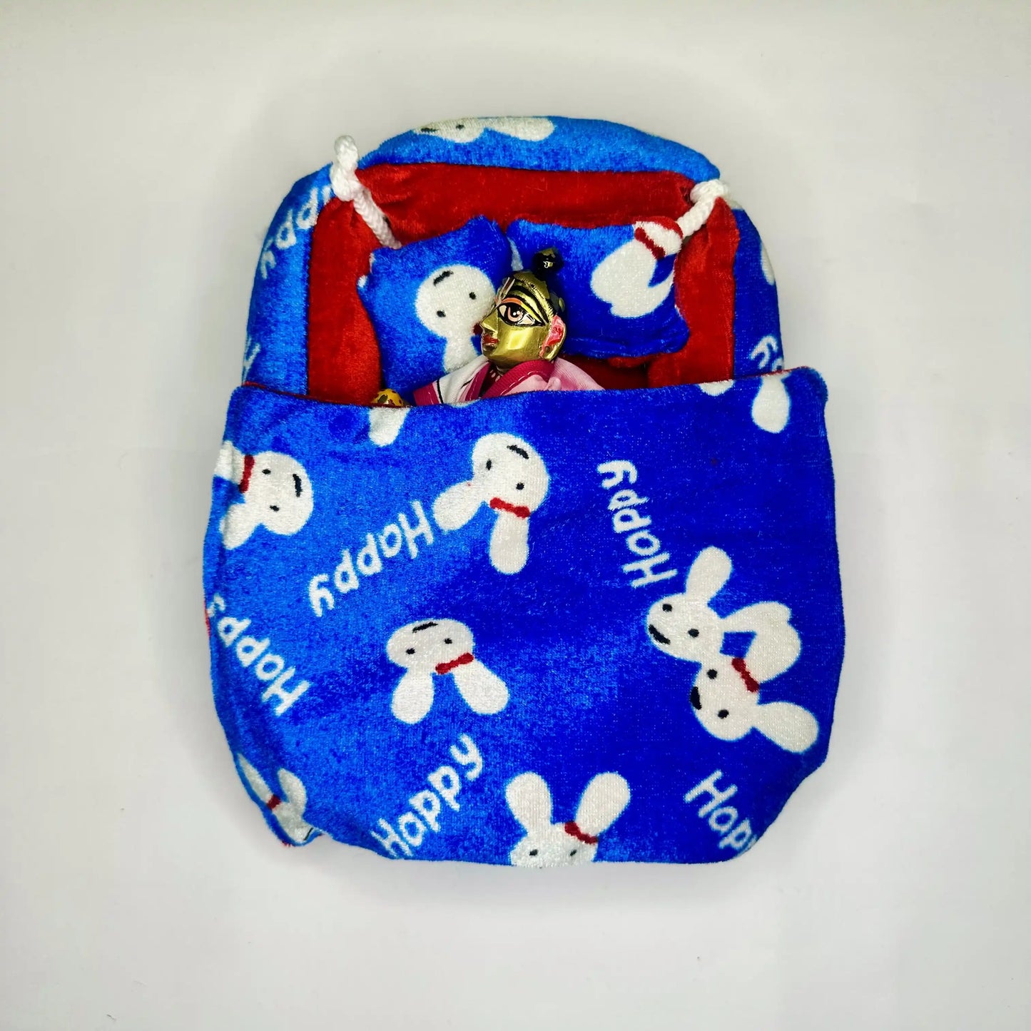 Laddu gopal ji sleeping in a Blue & Red Bunny Print Winter Laddu Gopal Bedding Set with Pillow with Blanket.