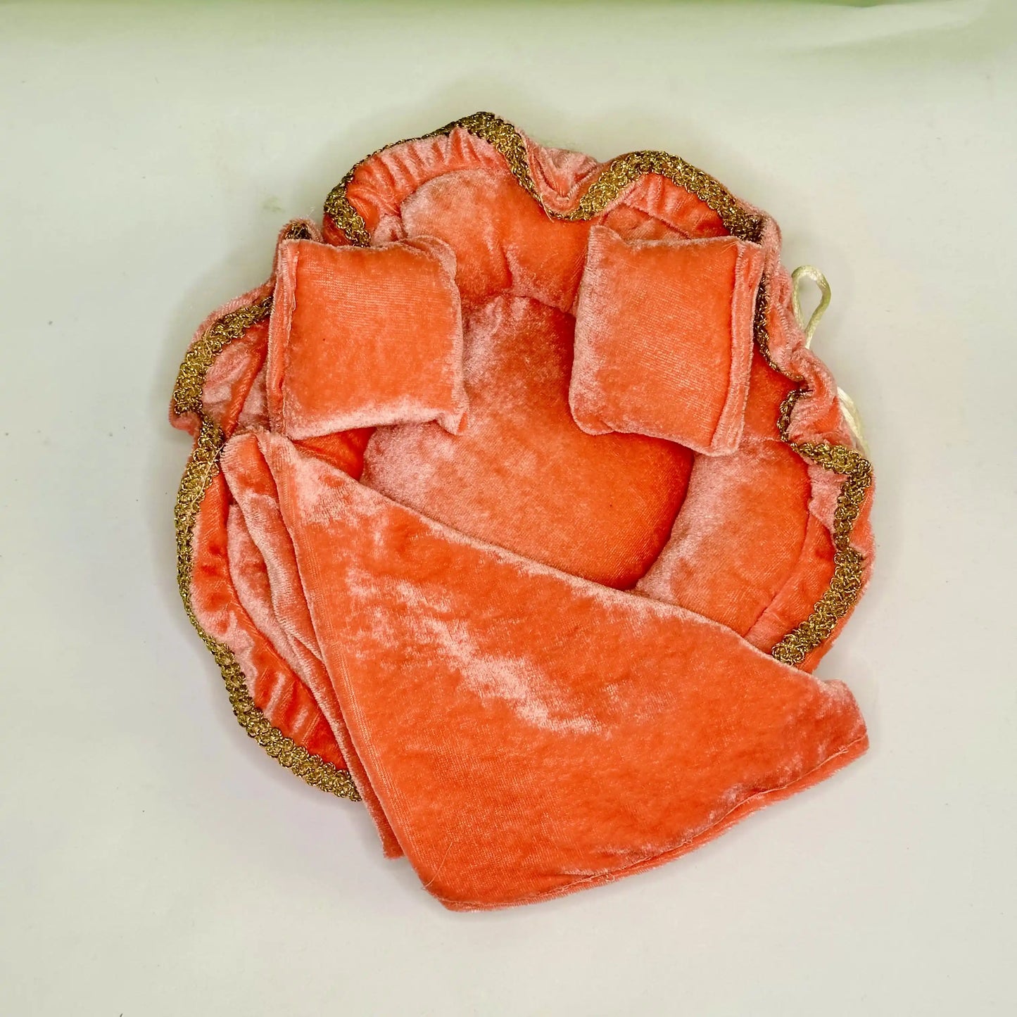 Top view of an Elegant Orange Velvet Laddu Gopal Bedding Set with Golden Lace, Blanket & Pillow.