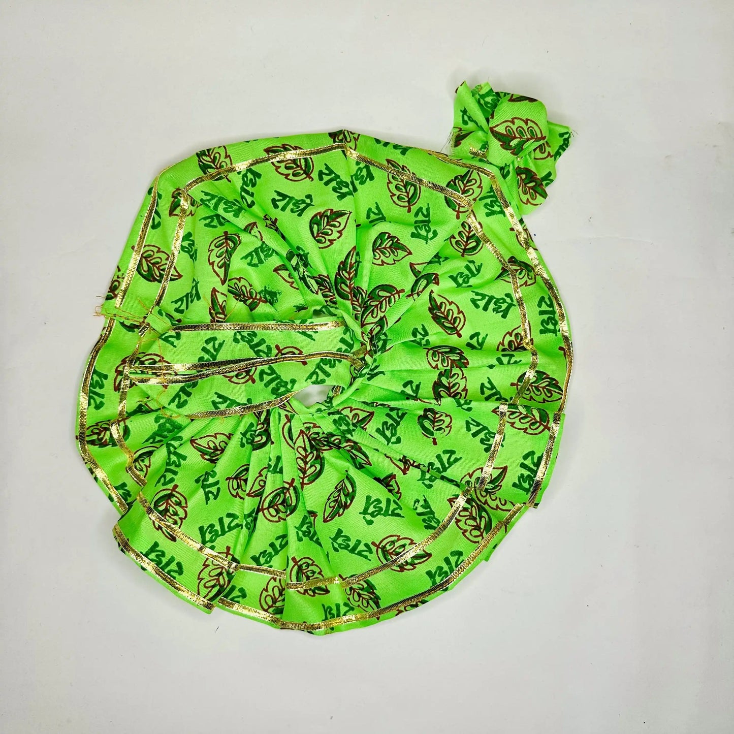 Top view of a Bright Green Radhe Radhe Printed Laddu Gopal ji dress with Golden Lace with Matching Pagdi.