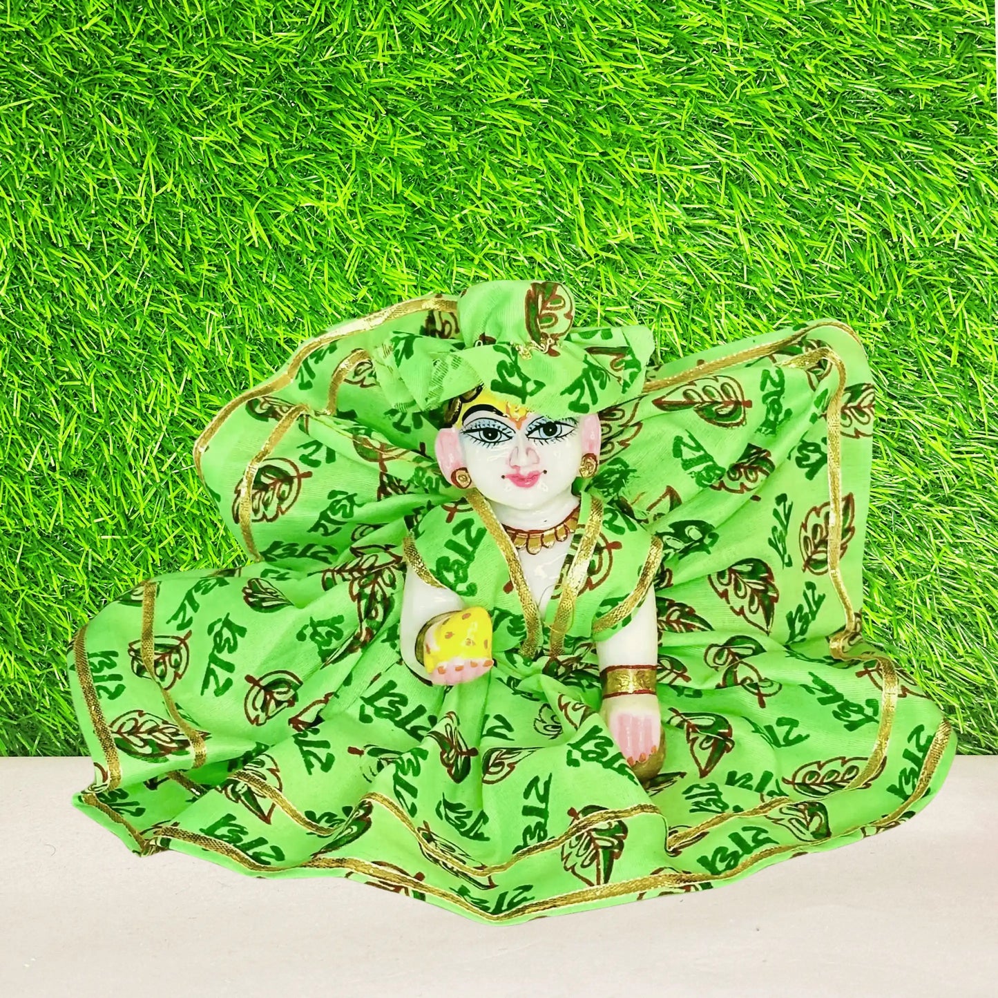 Laddu gopal ji in a Bright Green Radhe Radhe Printed Laddu Gopal Poshak with Golden Lace with Matching Pagdi.