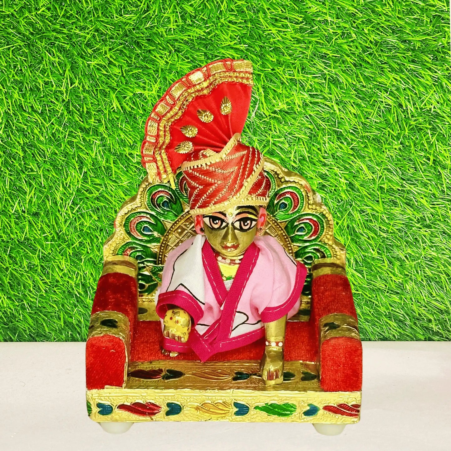 Kanha ji stting on a Handcrafted Peacock Laddu Gopal Singhasan Decorative Multicolor Velvet Sofa.