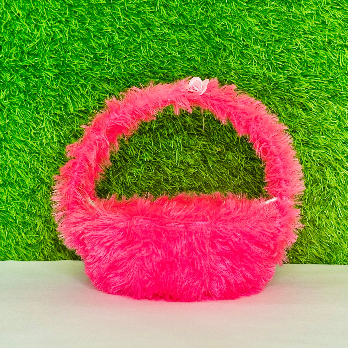 Front view of Kanha ji sitting in a Pink Fur Comfirtable Carry Basket for Laddu Gopal Ji.
