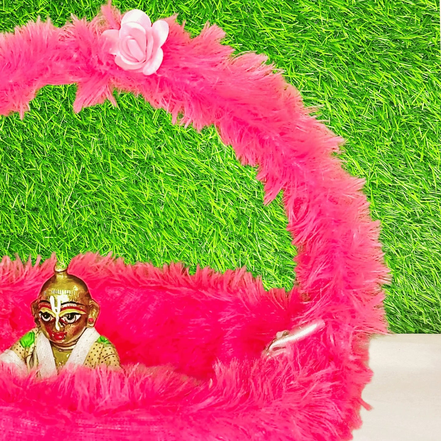 Close view of Kanha ji sitting in a Pink Fur Comfirtable Carry Basket for Laddu Gopal Ji.