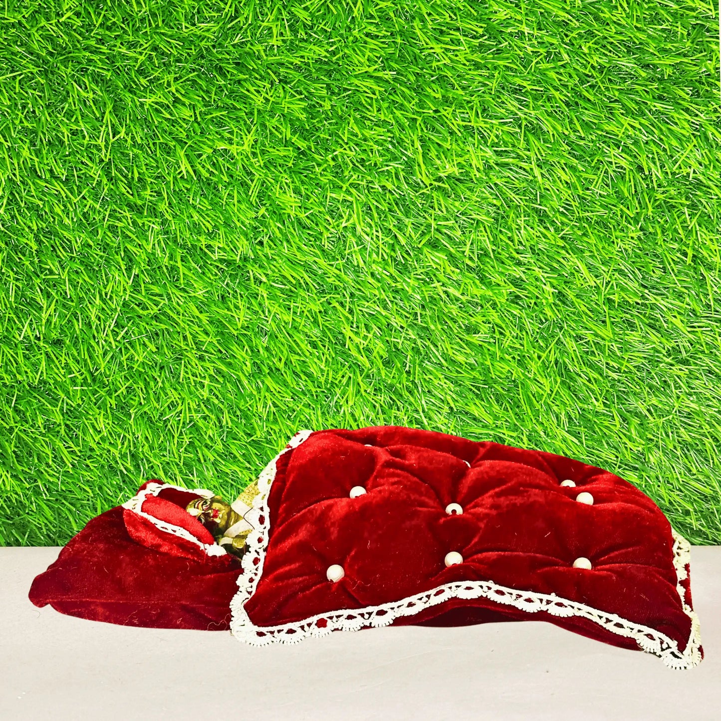 Kanha ji sleeping in a Premium Maroon Shaneel Laddu Gopal Bedding Set with Blanket & Pillow.