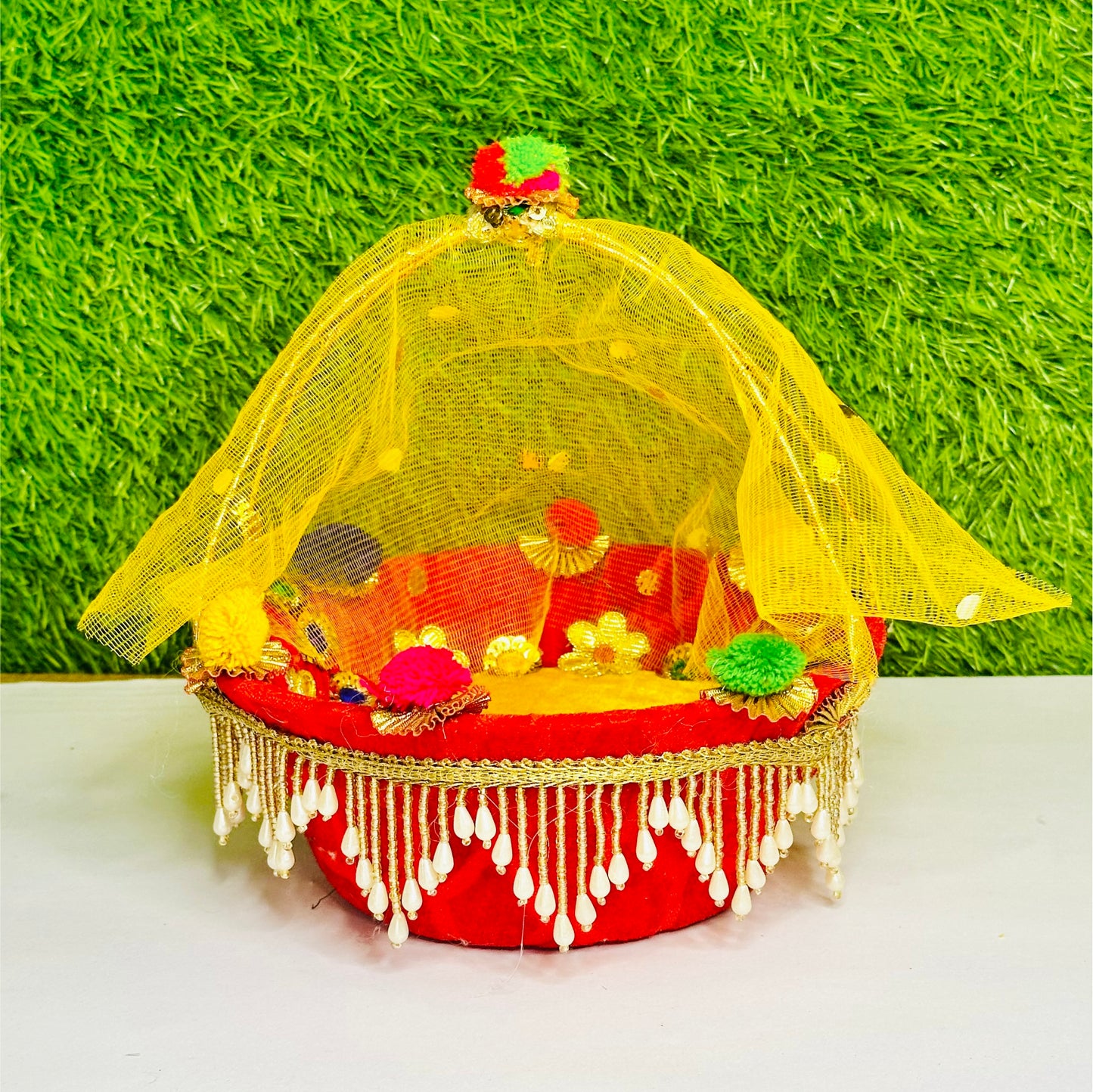 Front view of a Red & Yellow Heavy Lace Work Laddu Gopal Carry Basket.
