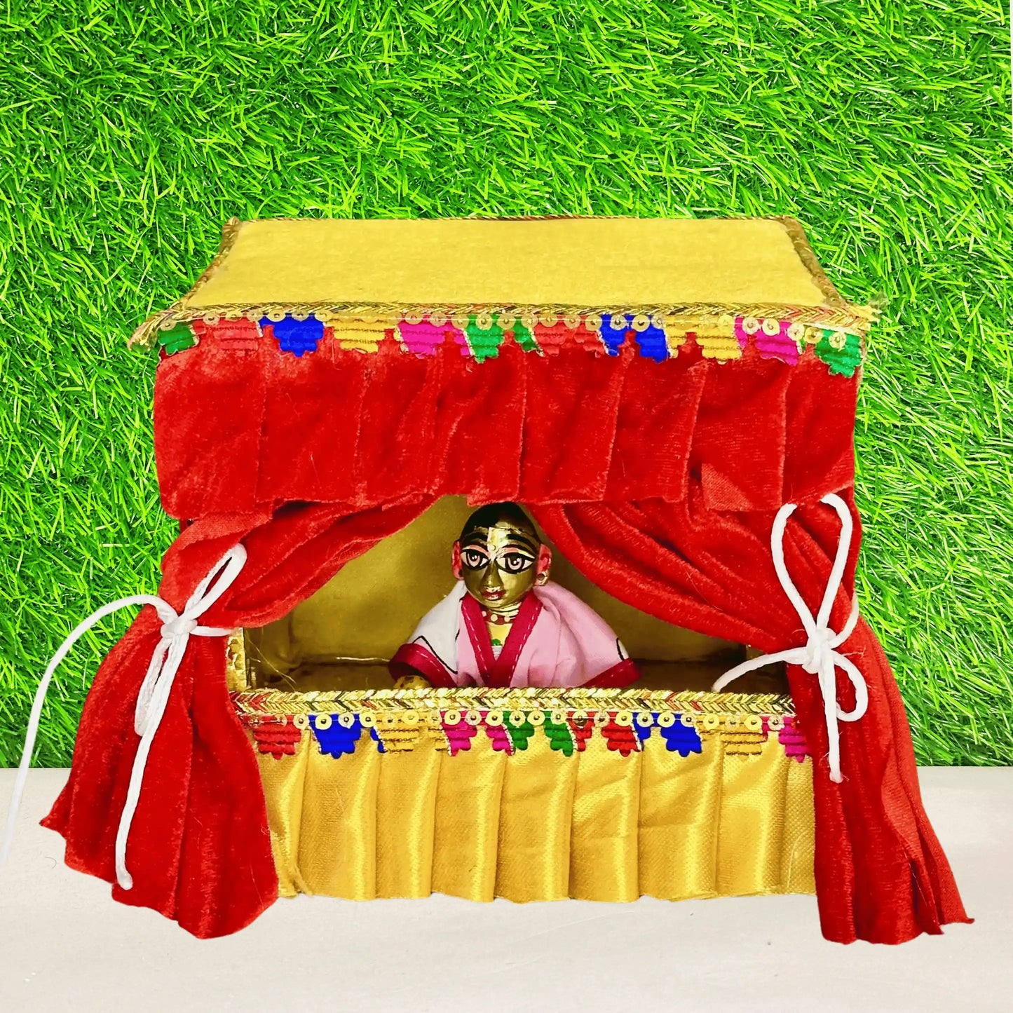 Kanha ji in an attractive Red & Yellow Velvet Laddu Gopal Singhasan with Decorative Jhula.