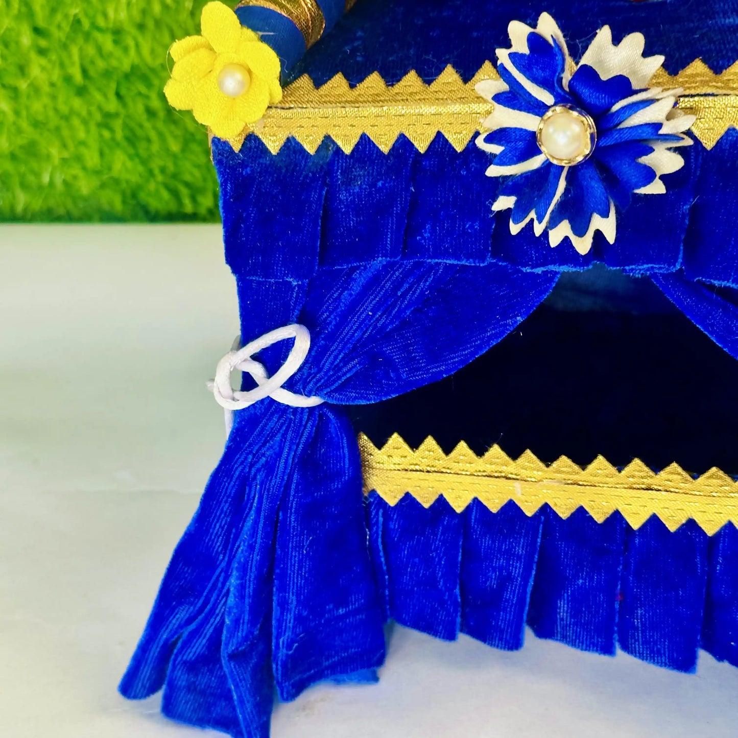 Close view of a Royal Blue Velvet Laddu Gopal Singhasan Jhula, Beautiful Floral Decoration.