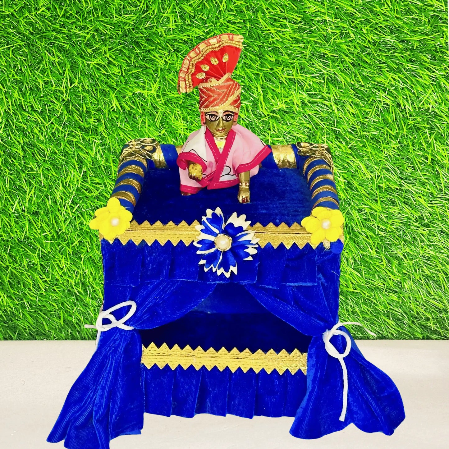 Kanha ji stting on a Royal Blue Velvet Laddu Gopal Singhasan Jhula, Beautiful Floral Decoration.