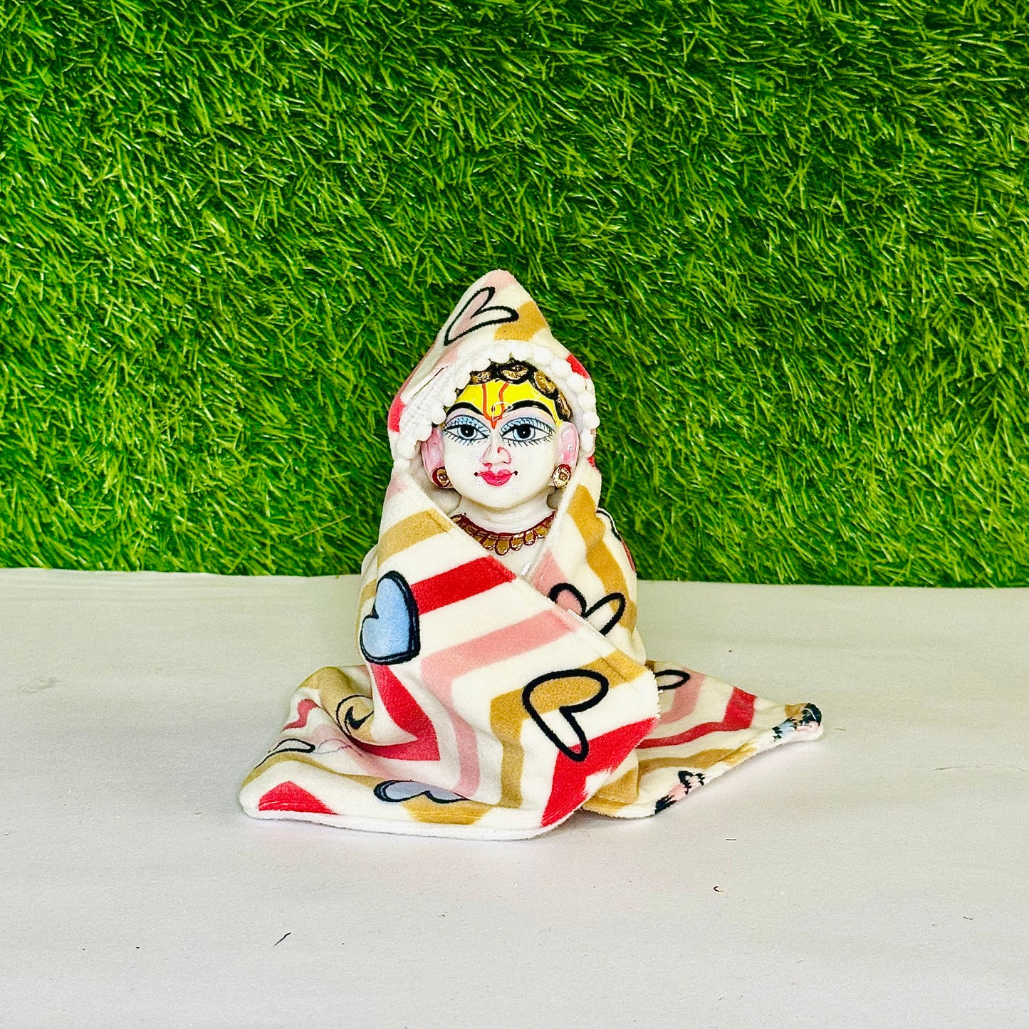 Front view of Kanha ji wearing a Shaneel Multicolor Winter Special Laddu Gopal Hoodie Blanket.