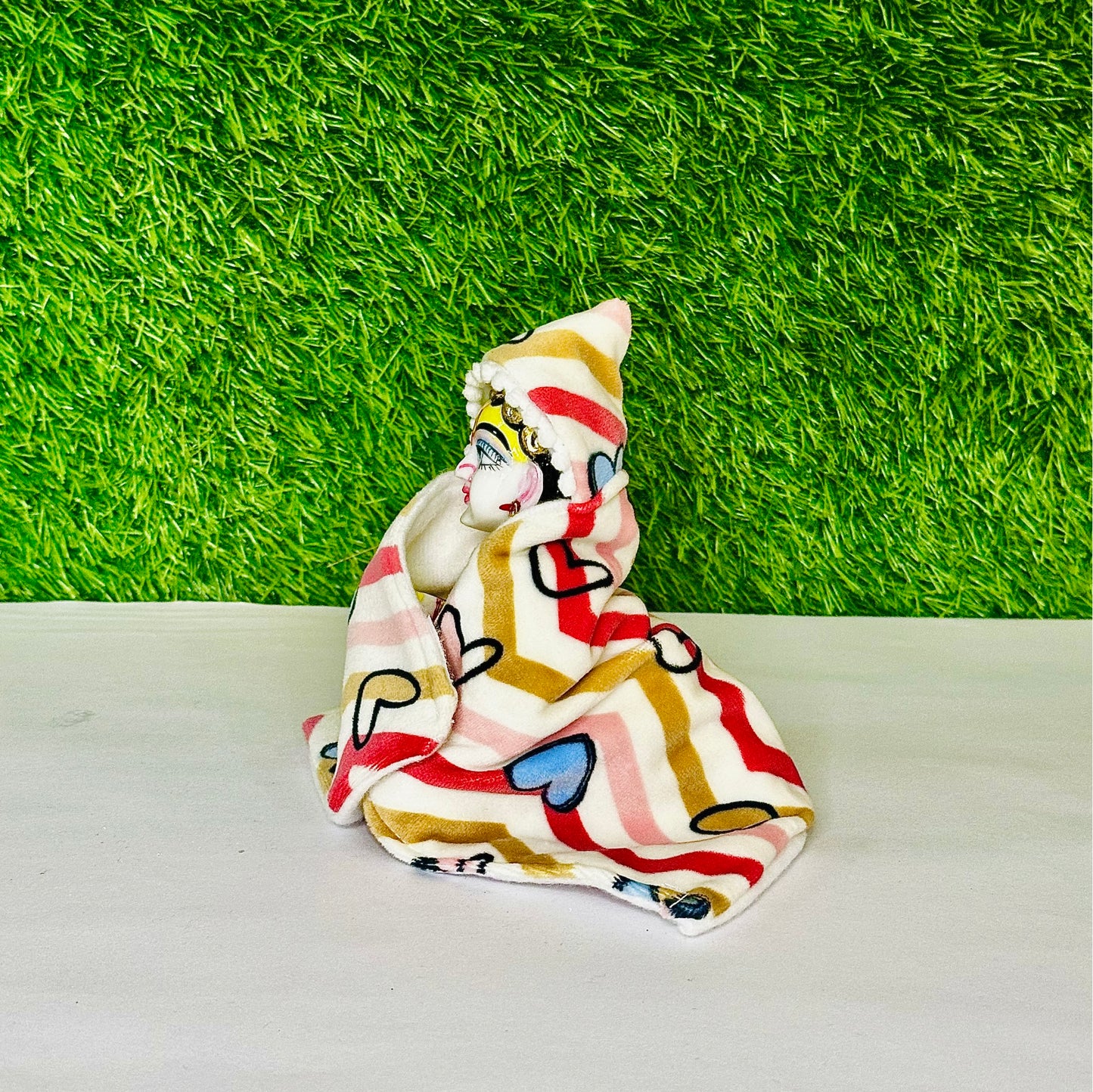 Side view of Kanha ji wearing a Shaneel Multicolor Winter Special Laddu Gopal Hoodie Blanket.