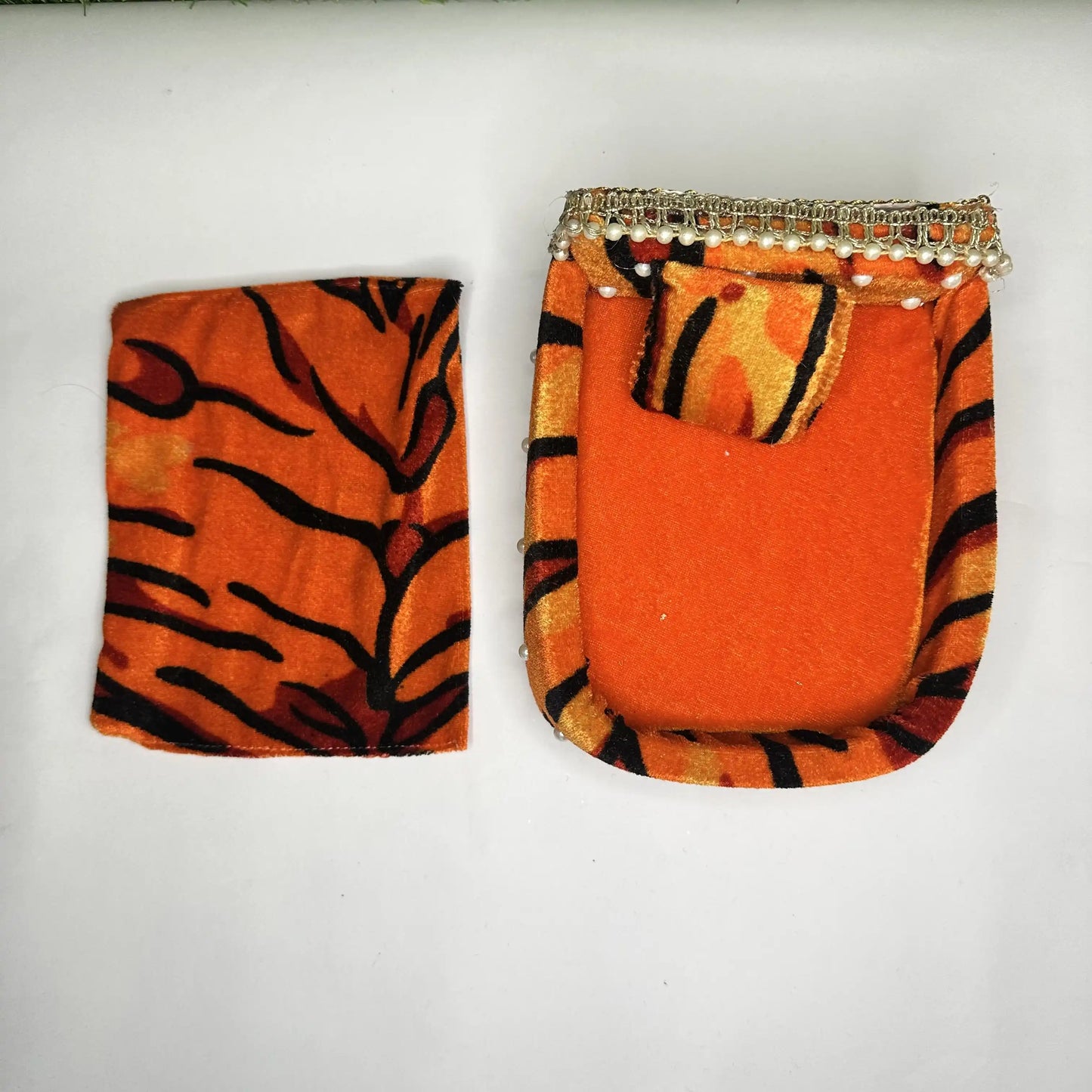 Top view of a Tiger Print Soft Velvet Laddu Gopal Bedding Set with Pearl Work & Blanket.
