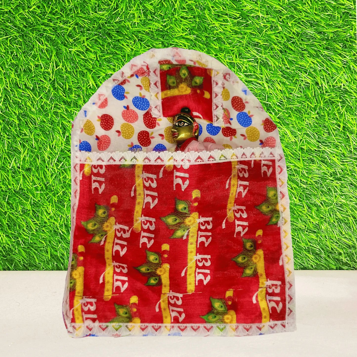 Laddu Gopal ji sleeping in a Traditional Cotton Printed Laddu Gopal Bedding Set with Red Radhe Radhe Blanket & Strawberry color Base.