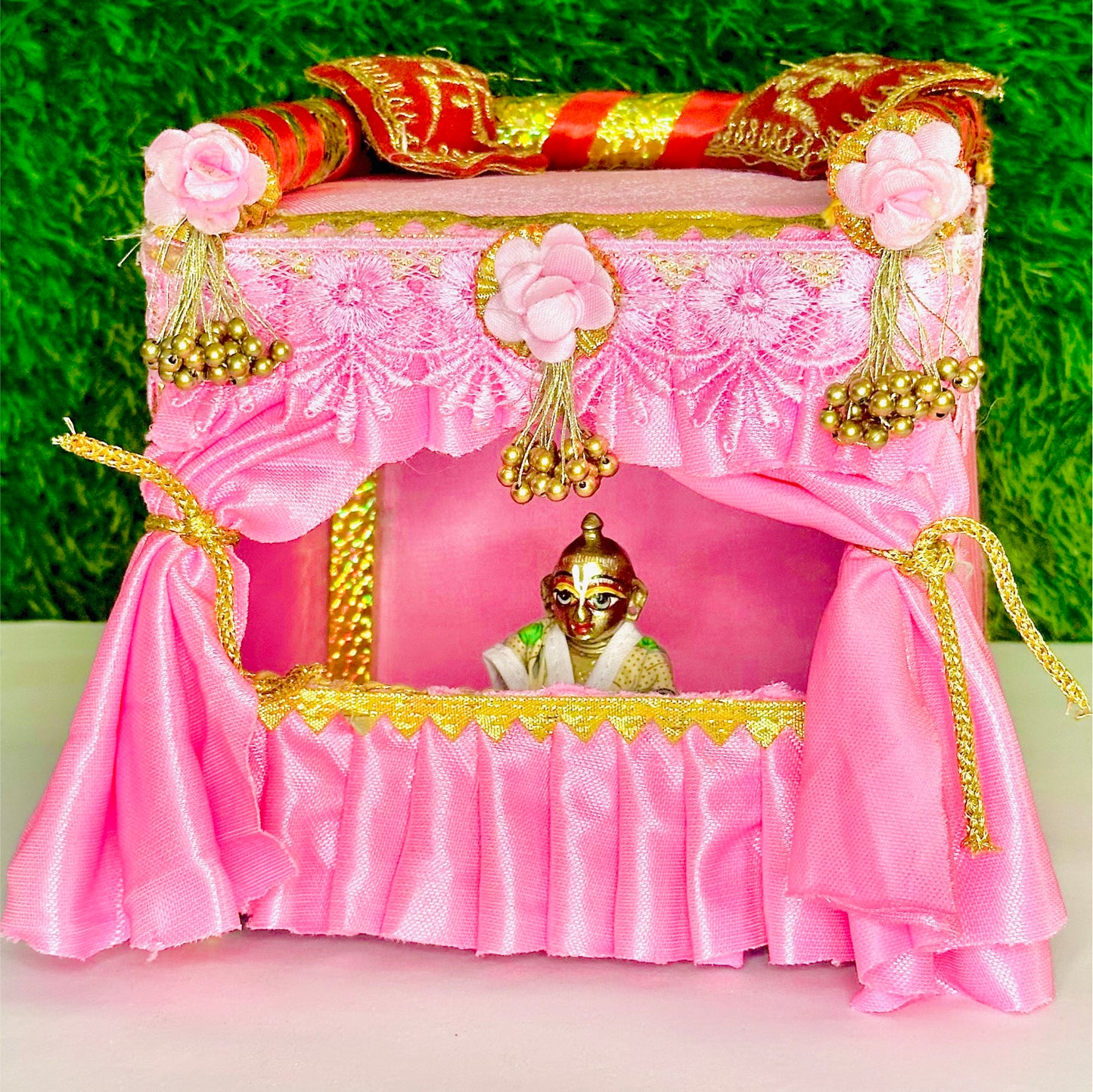 Front view of a Unique Wooden Pink Silk Laddu Gopal Bed cum Singhasan.