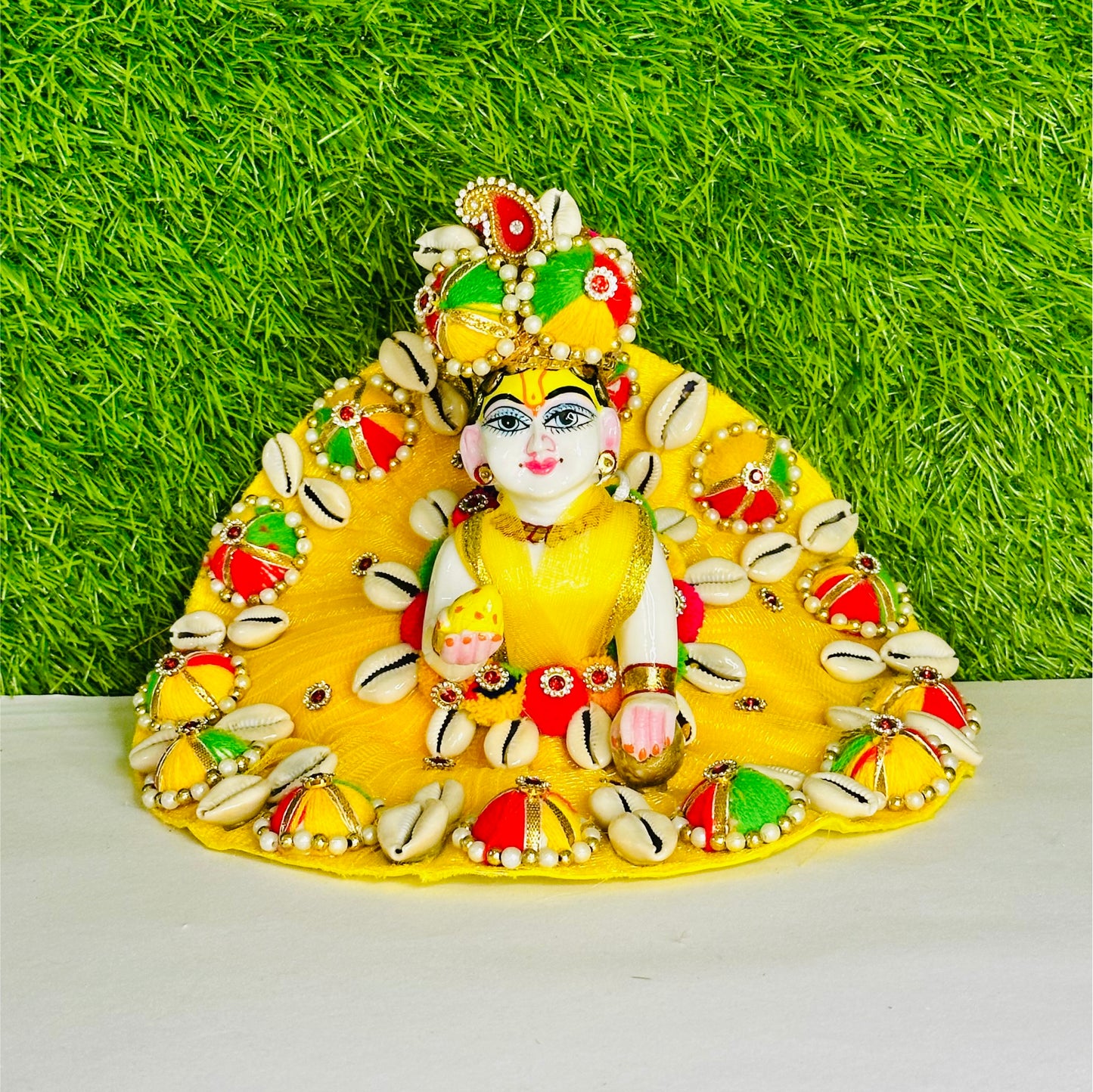 Front view of Kanha ji wearing a Heavy Yellow Kodi & Multicolor Cap Work Laddu Gopal Poshak.