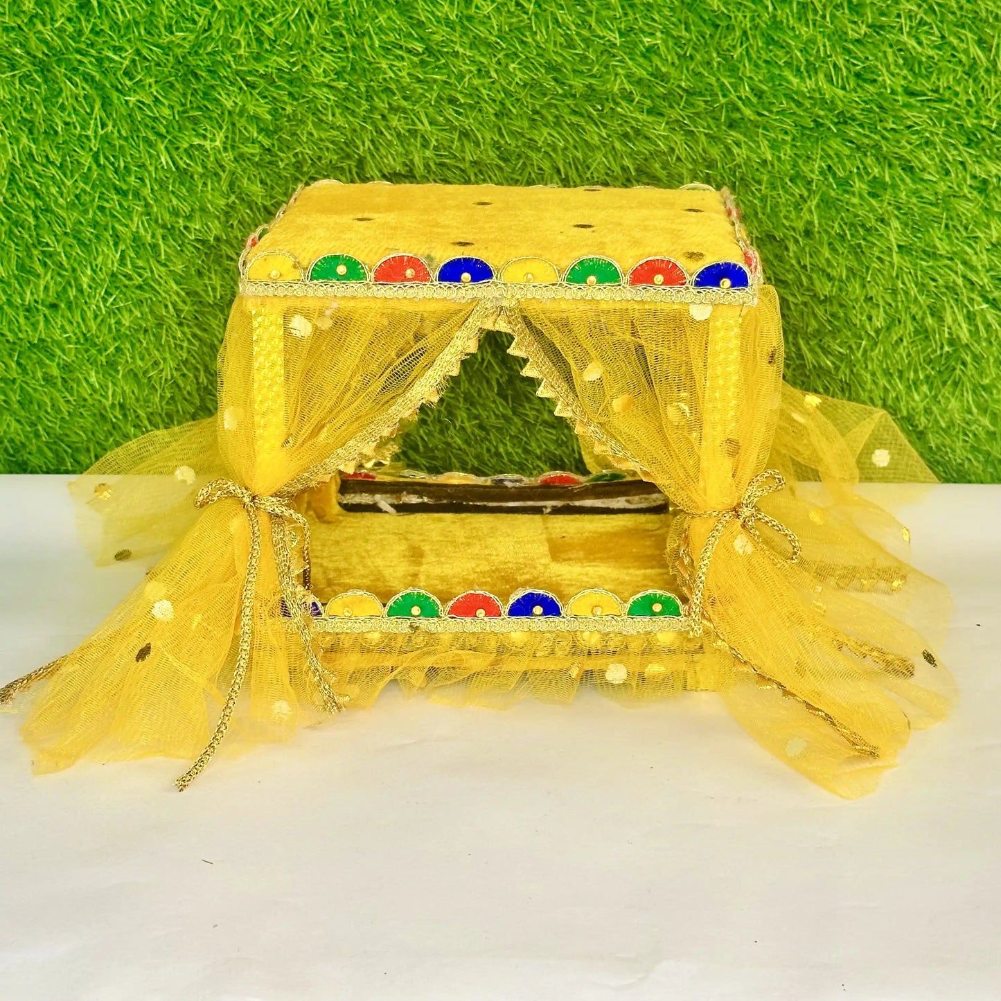 Front view of a Beautiful Yellow Laddu Gopal Singhasan Bed, Decorative Jhula with Designer Border.