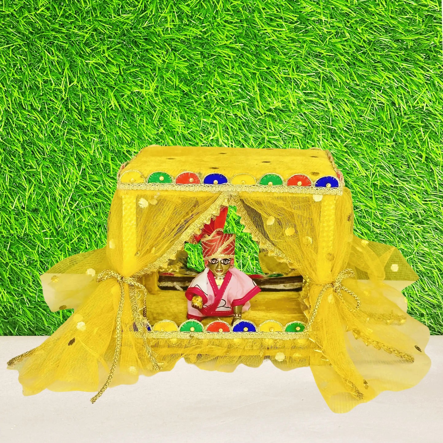 Kanha ji sitting in a Beautiful Yellow Laddu Gopal Singhasan Bed, Decorative Jhula with Designer Border.