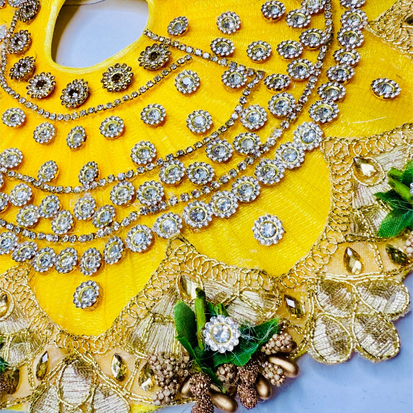 Close view of a Yellow Velvet Stone Chain Work Heavy Laddu Gopal Dress.