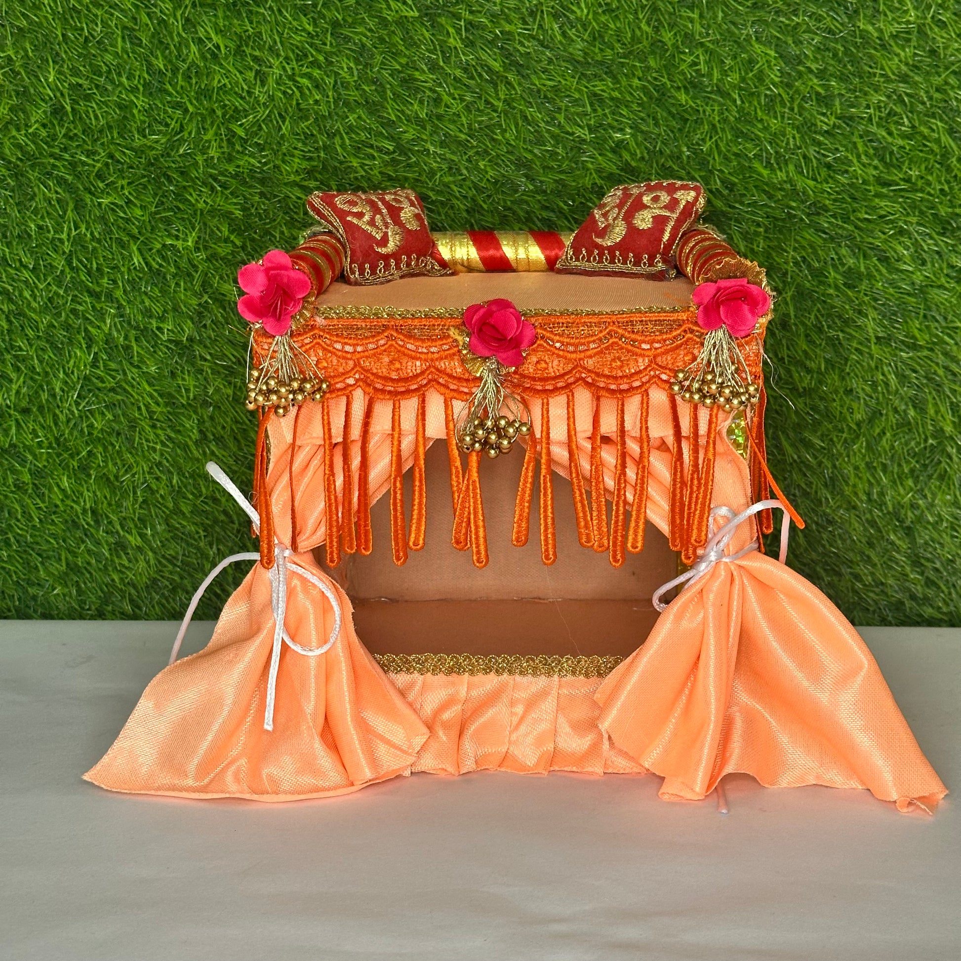 Peach color laddu gopal ji singhasan and bed.